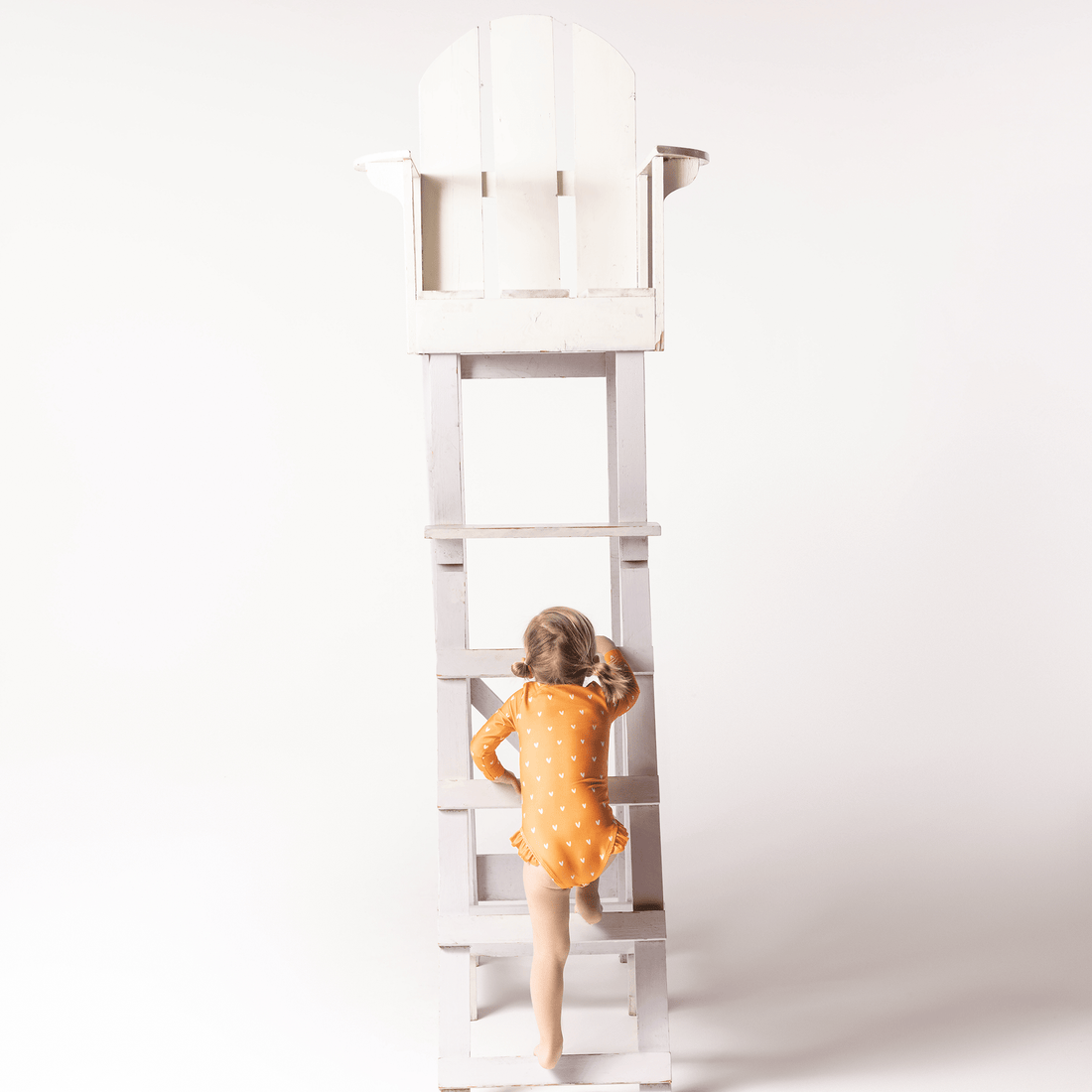 costume-intero-bambina-con-mani-lunghe-arancio-con-cuori-nuotare-essenziali-1